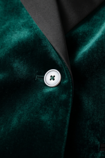 Green double-breasted dinner jacket by PAMONI, tailored fit with peak lapels and satin trim, shown on a hanger.