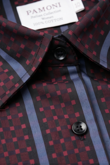 Close-up of a patterned shirt with visible buttons and a brand label.