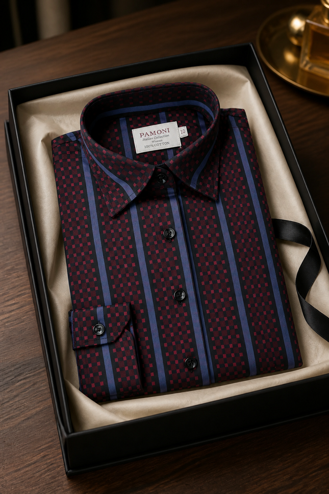 Folded patterned shirt in a box with 'Pamoni' label on a wooden surface