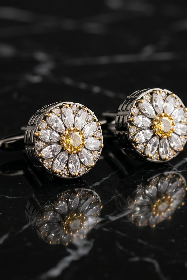 Pair of diamond cufflinks on a reflective black surface
