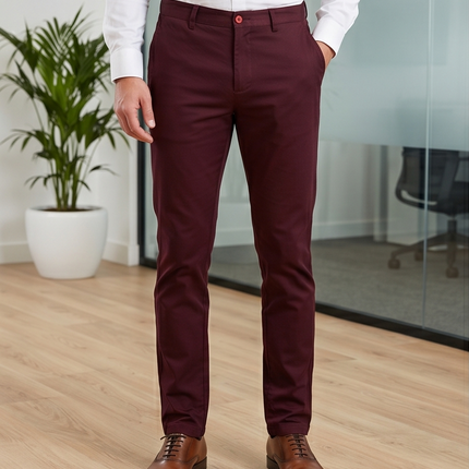 Person wearing maroon pants and brown shoes in an office setting