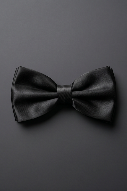Black bow tie on a dark gray background