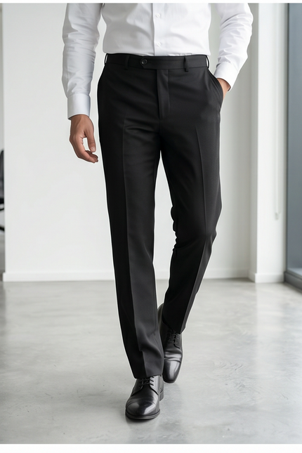 Person wearing a white dress shirt and black pants in an office setting