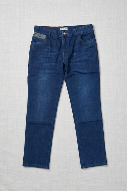 Blue jeans on a light gray textured background