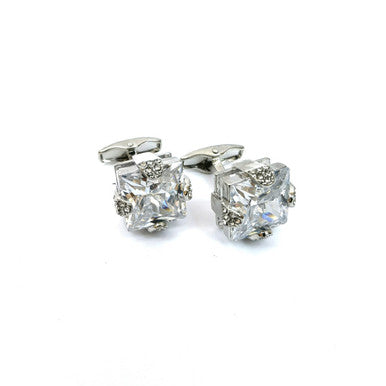 Silver gemstone cufflinks by PAMONI featuring polished metal and sparkling gemstones, ideal for formal attire.