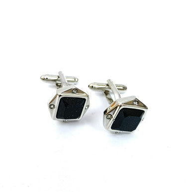 Black glitter gemstone cufflinks by PAMONI featuring shimmering black stones set in polished metal.