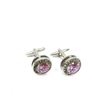 Round pink gemstone cufflinks by PAMONI featuring polished metal setting and elegant design for formal wear.