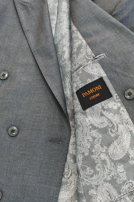 Close-up of a gray double-breasted suit jacket with a patterned gray and white paisley lining and a black PAMONI brand label.
