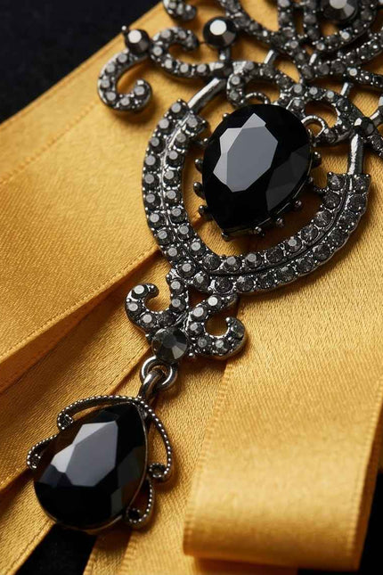 Ornate Gold Ribbon Bow with Black Crystal Embellishment